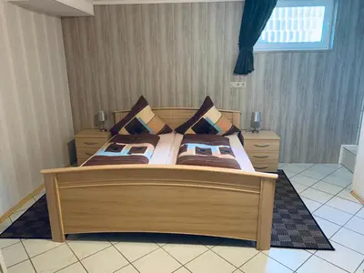 Ein Bett oder Betten in einem Zimmer der Unterkunft Ferienwohnung Hochwaldblick 3
