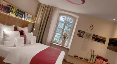 Ein Bett oder Betten in einem Zimmer der Unterkunft Nells Park Hotel