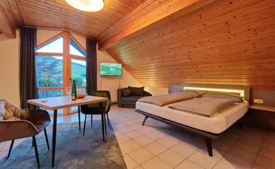 Ein Bett oder Betten in einem Zimmer der Unterkunft Weingut Schumann