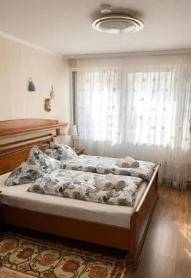 Ein Bett oder Betten in einem Zimmer der Unterkunft Schönes Apartment mit Pool&Sauna