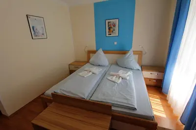 Ein Bett oder Betten in einem Zimmer der Unterkunft Hotel Adria Stuben