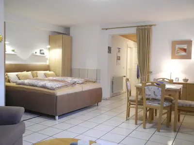Ein Bett oder Betten in einem Zimmer der Unterkunft Ferienwohnung Heinen