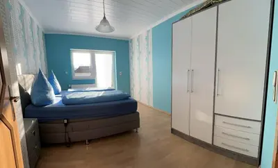 Ein Bett oder Betten in einem Zimmer der Unterkunft Ferienwohnung Hochwaldblick 1