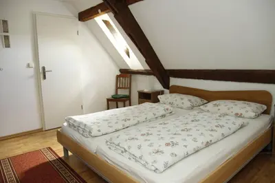 Ein Bett oder Betten in einem Zimmer der Unterkunft Schwalbennest auf dem Weingut Arthur Melsheimer