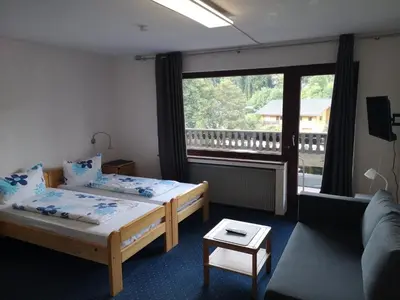 Ein Bett oder Betten in einem Zimmer der Unterkunft Hotel Finkenberg