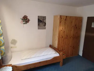 Ein Bett oder Betten in einem Zimmer der Unterkunft Hotel Finkenberg