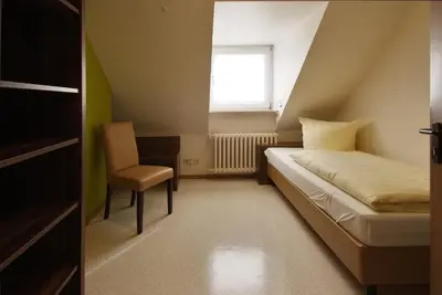 Ein Bett oder Betten in einem Zimmer der Unterkunft L' Angolo Ristorante & Hotel GmbH