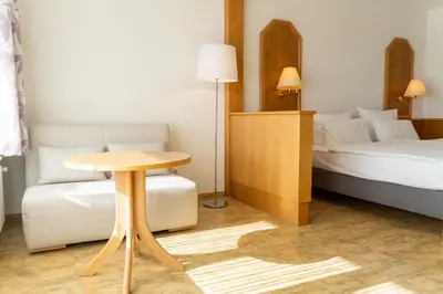 Ein Bett oder Betten in einem Zimmer der Unterkunft Hotel Bergschlößchen