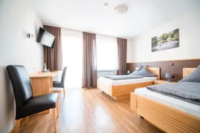 Ein Bett oder Betten in einem Zimmer der Unterkunft Hotel-Restaurant Langen