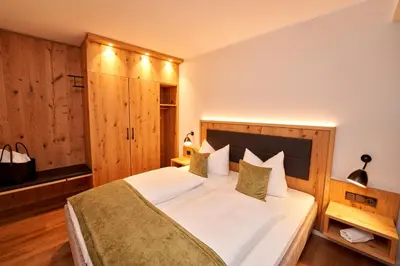 Ein Bett oder Betten in einem Zimmer der Unterkunft Sporthotel Grafenwald 4 Sterne Superior