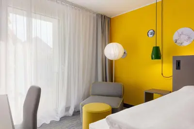 Ein Bett oder Betten in einem Zimmer der Unterkunft Vienna House Easy by Wyndham Trier