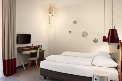 Ein Bett oder Betten in einem Zimmer der Unterkunft Vienna House Easy by Wyndham Trier