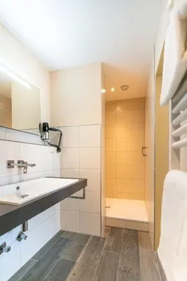 Ein Badezimmer in der Unterkunft Hotel Restaurant Pollmanns