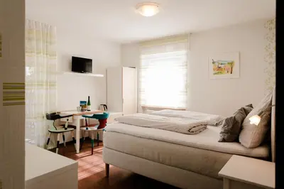 Ein Bett oder Betten in einem Zimmer der Unterkunft Ferien Weingut Schneider