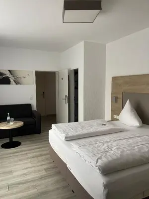 Ein Bett oder Betten in einem Zimmer der Unterkunft Hotel Traumblick