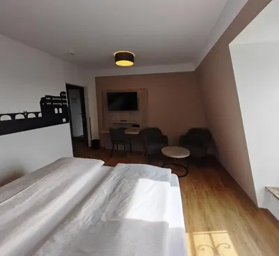 Ein Bett oder Betten in einem Zimmer der Unterkunft Berghotel Kockelsberg