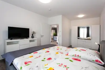 Ein Bett oder Betten in einem Zimmer der Unterkunft Kaiser - Ferienwohnungen Dreiburgenblick