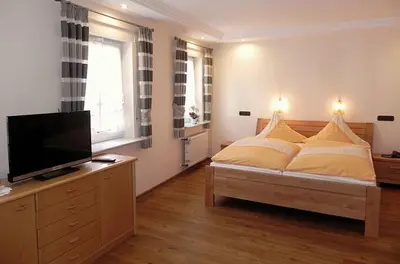 Ein Bett oder Betten in einem Zimmer der Unterkunft Gästehaus Freimuth