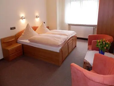 Ein Bett oder Betten in einem Zimmer der Unterkunft Gästehaus Freimuth