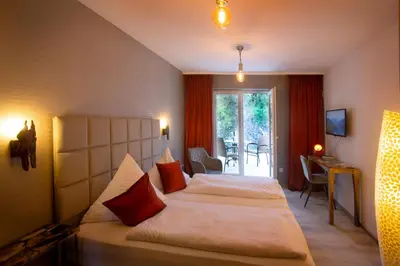 Ein Bett oder Betten in einem Zimmer der Unterkunft Bad Emser Hof