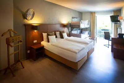 Ein Bett oder Betten in einem Zimmer der Unterkunft Bad Emser Hof