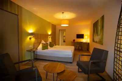 Ein Bett oder Betten in einem Zimmer der Unterkunft Bad Emser Hof