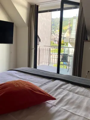 Ein Bett oder Betten in einem Zimmer der Unterkunft Hotel am Hafen