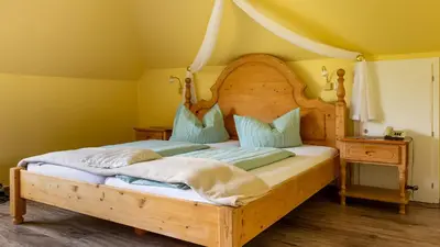 Ein Bett oder Betten in einem Zimmer der Unterkunft Hotel Villa Tummelchen