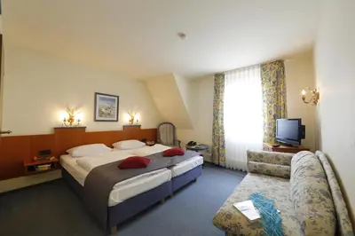 Ein Bett oder Betten in einem Zimmer der Unterkunft Hotel Karl Noss