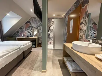 Ein Badezimmer in der Unterkunft Hotel Germania