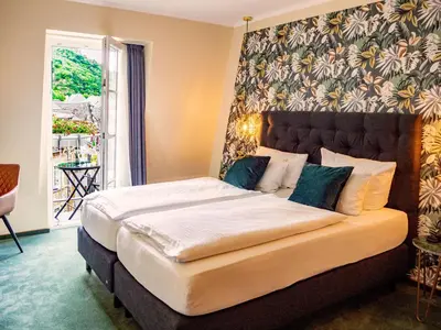 Ein Bett oder Betten in einem Zimmer der Unterkunft Hotel Germania