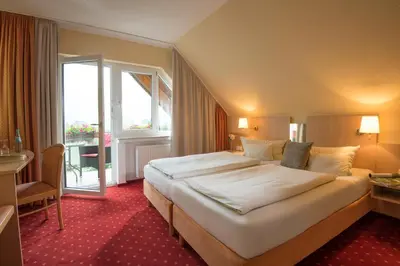 Ein Bett oder Betten in einem Zimmer der Unterkunft Weinhotel Sonnenschein