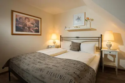 Ein Bett oder Betten in einem Zimmer der Unterkunft Weinhotel Sonnenschein
