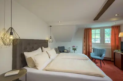 Ein Bett oder Betten in einem Zimmer der Unterkunft Hotel Weinhof