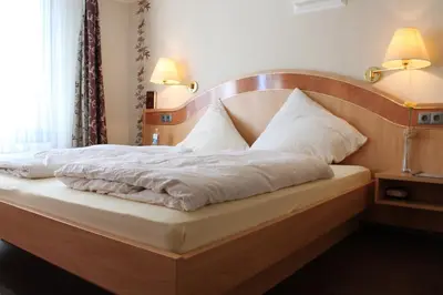 Ein Bett oder Betten in einem Zimmer der Unterkunft Hotel Weinhof