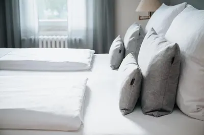 Ein Bett oder Betten in einem Zimmer der Unterkunft Coffee Fellows Hotel Trier