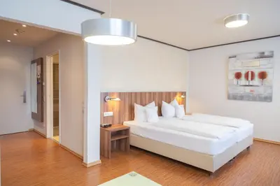 Ein Bett oder Betten in einem Zimmer der Unterkunft Das Ebertor - Hotel & Hostel