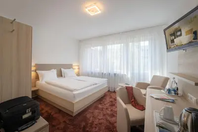 Ein Bett oder Betten in einem Zimmer der Unterkunft Hotel Brenner