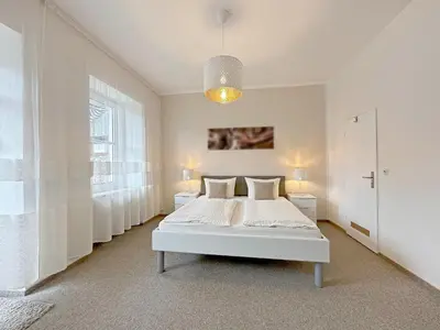 Ein Bett oder Betten in einem Zimmer der Unterkunft Gast und Weinhof Beim Schneemann
