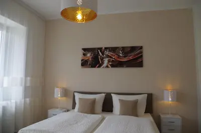 Ein Bett oder Betten in einem Zimmer der Unterkunft Gast und Weinhof Beim Schneemann