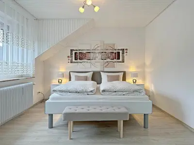 Ein Bett oder Betten in einem Zimmer der Unterkunft Gast und Weinhof Beim Schneemann