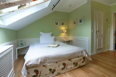 Ein Bett oder Betten in einem Zimmer der Unterkunft Blesius Garten