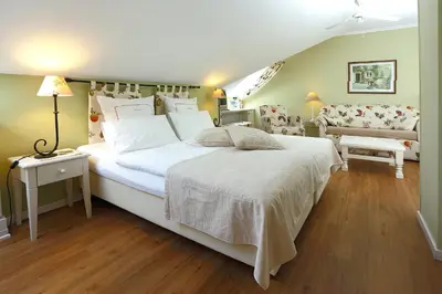 Ein Bett oder Betten in einem Zimmer der Unterkunft Blesius Garten