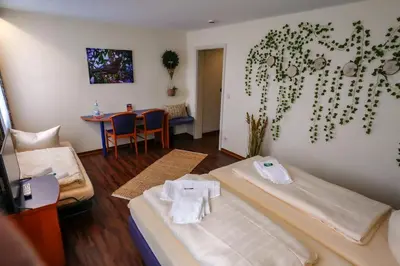 Ein Bett oder Betten in einem Zimmer der Unterkunft Hotel Stadt Daun