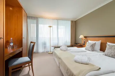 Ein Bett oder Betten in einem Zimmer der Unterkunft Wyndham Garden Lahnstein Koblenz