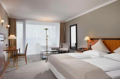 Ein Bett oder Betten in einem Zimmer der Unterkunft Wyndham Garden Lahnstein Koblenz