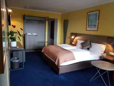 Ein Bett oder Betten in einem Zimmer der Unterkunft Hotel am Park