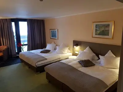 Ein Bett oder Betten in einem Zimmer der Unterkunft Hotel am Park