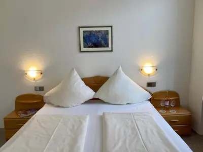 Ein Bett oder Betten in einem Zimmer der Unterkunft Hotel Hieronimi