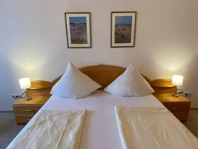 Ein Bett oder Betten in einem Zimmer der Unterkunft Hotel Hieronimi